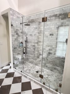 This was one of my favorite showers of the year. We centered the 30" door with glass to glass hinges