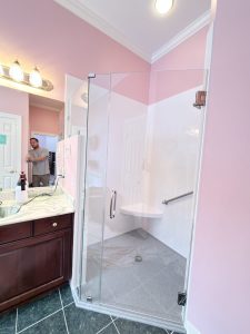 Here is a pretty unique shower. Usually the knee wall is not this tall, BUT we can design a custom door for any bathroom!